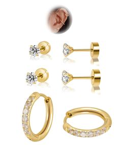 three pairs of gold plated nose piercings with clear crystal stones on each ear