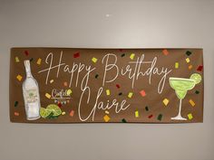 a happy birthday banner with drinks and confetti for someone's special occasion