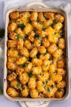 a casserole dish with cauliflower and parsley