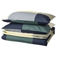 four pillows stacked on top of each other in different colors and sizes, with the same pillow