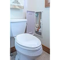 a white toilet sitting in a bathroom next to a window