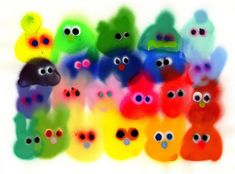 a group of multicolored teddy bears with big eyes