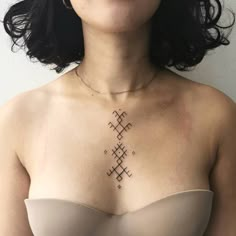 a woman with a tattoo on her chest