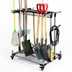 a rack with several different types of brooms and cleaning tools on it, including two mop's