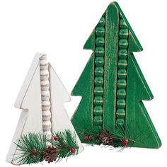 two wooden christmas trees sitting next to each other