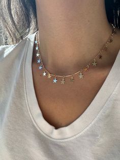 "Layer this beautiful star necklace with more of our necklaces.  18k gold filled  14\" length + 2\" extender  *18k gold filled is a more affordable alternative to solid gold jewelry. Gold filled is a layer of gold bonded onto a base metal with heat and pressure that contains 100+ times more gold than gold plated jewelry.  *It is very durable and tarnish resistant.  *With proper care, gold filled jewelry can last several years. Avoid contact with harsh chemicals, perfumes, water, etc.  *Gold filled jewelry can be worn by people with sensitive skin because it is hypoallergenic, lead free and nickel free.  If you have any questions, please message me." Gold Dainty Jewelry With Star Charm, Dainty Gold Jewelry With Star Charm, Everyday Star Charm Jewelry, Trendy Gold Star Jewelry, Trendy Gold Star Shaped Jewelry, Everyday Gold Plated Charm Necklace With Star Charm, Dainty 14k Gold Filled Star Charm Necklaces, Dainty 14k Gold Filled Star Charm Necklace, Adjustable Gold Jewelry With Star Charm