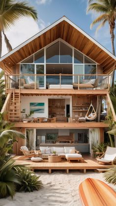 a wooden house on the beach with palm trees