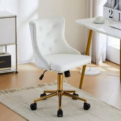 a white desk chair sitting on top of a wooden floor