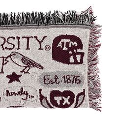 the university of texas tapestry is displayed on a white background with fringes and letters