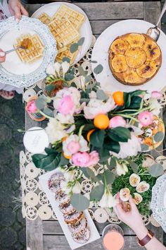 an overhead view of people sitting at a table with food