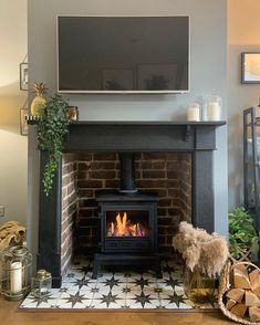 a fireplace with a television mounted above it