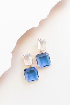 Add the perfect touch of sparkle to your look with our Clarice drop earrings! Royal blue square cut crystals dangle from clear rectangle cut crystal accents anchored with comfortable post back closures. Take your look from day to night with sophistication for any occasion! Short crystal drop earrings Blue & clear crystals Post backs Bright Blue Earrings, Bridal Party Earrings, Blue Bridal Earrings, Blue Drop Earrings, Wedding Earrings Drop, Wedding 2024, Blue Bridal, Party Earrings, Wedding Jewelry Earrings