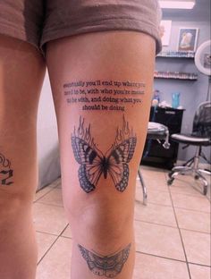 a woman's leg with a butterfly tattoo on it and a quote from the book