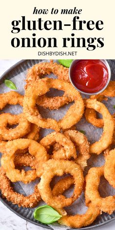 onion rings on a plate with ketchup and lettuce in the background