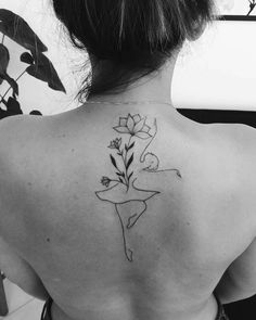 a woman with a flower tattoo on her back