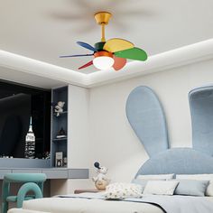 a bed room with a neatly made bed and a ceiling fan in the middle of it