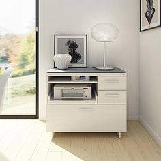 a white desk with a printer on top of it