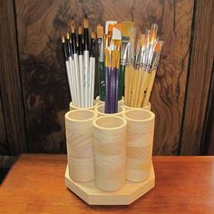 there are many pens and pencils in the holder