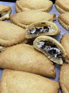 there are several pastries that have been cut in half and placed on top of each other