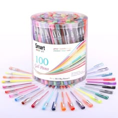 a container filled with lots of different colored pens