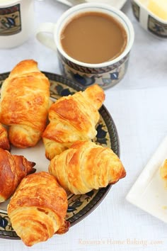 several croissants are arranged on a plate