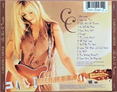 the cd cover shows a woman playing an electric guitar