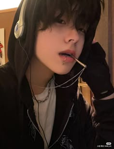 a young man wearing headphones and listening to music