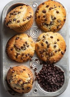 muffins and chocolate chips on a baking tray