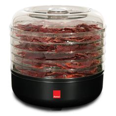 an electric food dehyzer with lots of meat in it's display case