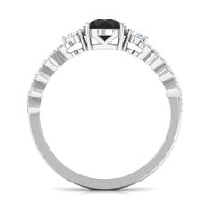 a white gold ring with black and white diamonds on the side, set in 18k white gold