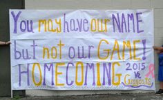 two children standing next to a sign that says you may have our name but not our game