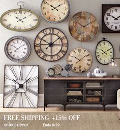 a bunch of clocks that are on the wall