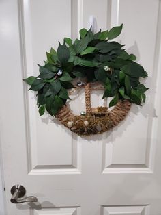 a wreath is hanging on the front door