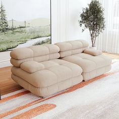 a couch sitting on top of a rug in a living room