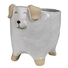 a white ceramic dog planter with a brown nose