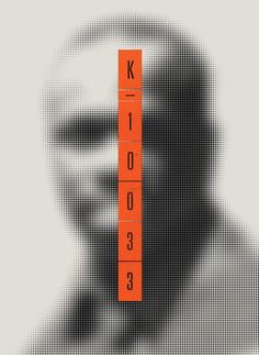 a man's face is shown with an orange ruler in the foreground that reads k - 1 003