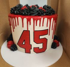 a birthday cake decorated with red and white icing