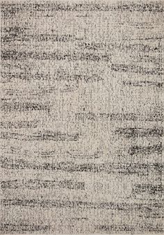 an area rug with black and white lines on the ground, in shades of gray