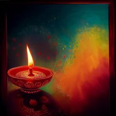 a lit candle sitting on top of a glass bowl in front of a colorful background