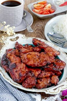 chicken wings on a plate with rice and coffee