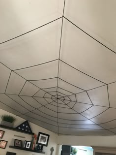 the ceiling is decorated with black and white spider webs