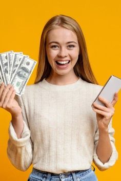 a woman holding money and a cell phone