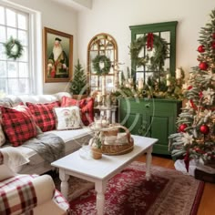 a living room decorated for christmas with red and green decorations