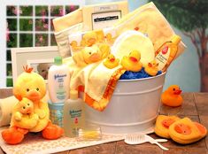 a baby shower gift basket with rubber ducks