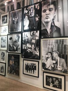 a wall full of black and white photos