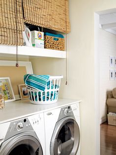 the laundry room is clean and ready to be used as a washer and dryer