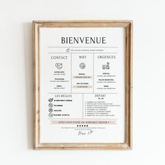 a poster hanging on the wall above a wooden frame