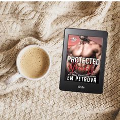 a book titled protected by an e - reader next to a cup of coffee on a blanket