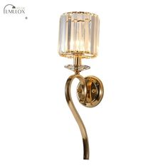 a wall light with a glass shade on it