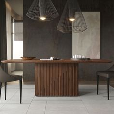 a dining room table with two chairs and a bowl on it